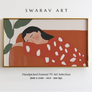 May include: A framed illustration of a person sleeping on a red couch with white polka dots. The person has long black hair and is wearing a red and white polka dot shirt. The background is a light beige color.