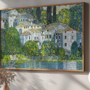 May include: A painting of a village with white houses and green trees, set against a blue sky and a body of water. The houses are clustered together, and the trees are lush and green. The water is calm and reflective, and the sky is clear and blue.
