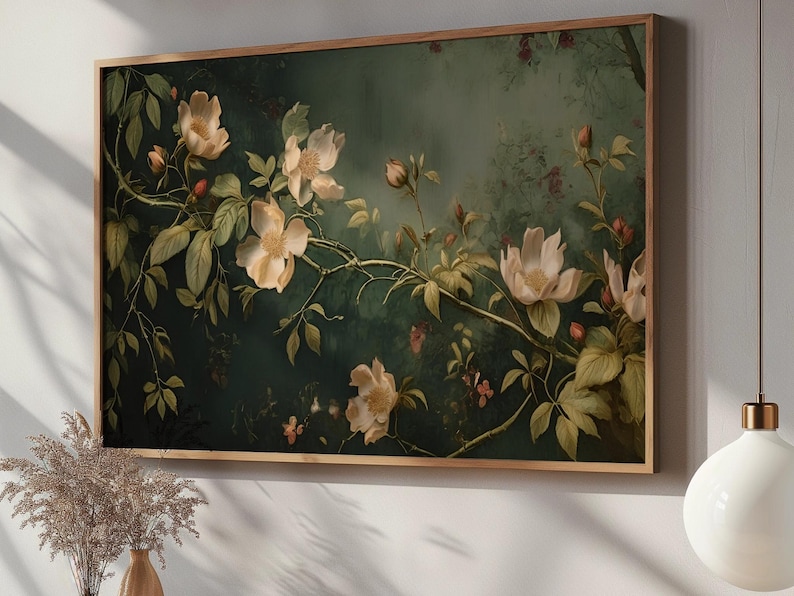 May include: A framed botanical print featuring delicate white flowers with yellow centers, blooming on a dark green vine. The background is a soft, muted green with a hazy, atmospheric effect.