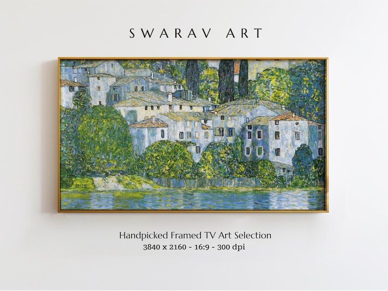May include: A framed painting of a village scene with white buildings and green trees. The buildings are clustered together on a small island in a lake. The water is a light blue color and the sky is a light gray color. The painting is in a gold frame.