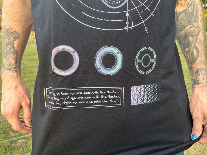 May include: Black tank top with a graphic design featuring three circular symbols, a geometric pattern, and the text "Only in time, ye are one with the Master. Only by right, ye are one with the Master. Only by right, ye are one with the All."