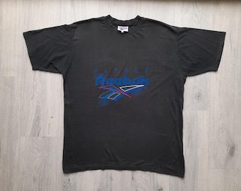 Camiseta Reebok Planet XXL vintage, camiseta Reebok vintage, camiseta Reebok Planet de los 90, camiseta gráfica Reebok de los 90, Reebok vintage, camiseta Reebok