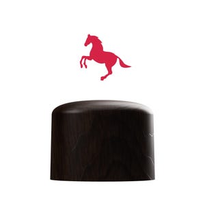 May include: A dark brown wooden lid with a red silhouette of a horse jumping in the air.