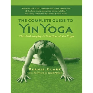 May include: Book cover with a green background and a woman in a yoga pose. The title is "The Complete Guide to Yin Yoga" and the author is Bernie Clark. The subtitle is "The Philosophy & Practice of Yin Yoga".