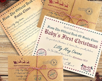 May include: A collection of stationery including a letter from the Official Desk of Santa Claus, a Baby's First Christmas certificate, and two kraft paper envelopes tied with red and white twine, featuring North Pole Express stamps.
