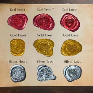May include: Nine wax seals with different designs and colors. The designs include a heart, a tree, and a love symbol. The colors are red, gold, and silver.
