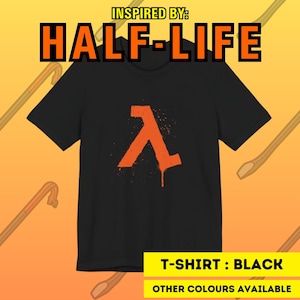 May include: A black short-sleeved t-shirt featuring an orange lambda symbol with a spray-paint drip effect on the chest. The text INSPIRED BY: HALF-LIFE appears at the top, and T-SHIRT : BLACK OTHER COLOURS AVAILABLE is at the bottom.