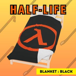 May include: Black fleece blanket featuring the Half-Life logo in orange. The logo is a circle with a stylised letter A inside. The blanket is folded on a wooden bed frame. BLANKET : BLACK