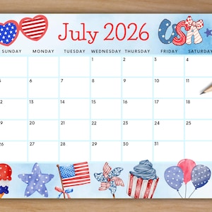 May include: A July 2026 calendar with a light blue background and patriotic themed illustrations. The calendar features red, white, and blue accents, including hearts, stars, and the American flag. Pencils are in the top right corner.