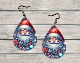 May include: Teardrop-shaped Christmas earrings featuring Santa Claus with a red hat and white beard. The earrings have a blue background with snowflakes and festive decorations. The earrings have a bronze-colored hook.
