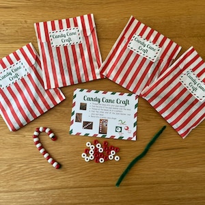 May include: A candy cane craft kit with red and white striped bags labelled "Candy Cane Craft." Includes a candy cane, beads, green pipe cleaner, and instructions. Ideal for a festive activity.