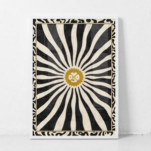 May include: A rectangular wall art print featuring a central gold sunburst icon with a four-leaf clover shape inside. Radiating wavy black and cream stripes extend outward, enclosed by a decorative border with a wavy black and white pattern.