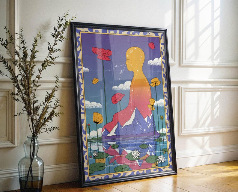 May include: A framed illustration of a person sitting on a mountain with a blue, purple, and pink gradient background. The person is yellow and has a blue sky behind them. There are flowers and leaves in the foreground.