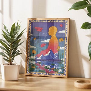 May include: A framed print of a colorful abstract illustration depicting a person sitting in a lotus position with a mountain range behind them. The background is a blue sky with clouds and flowers.