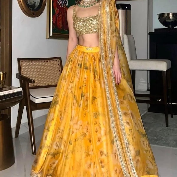Yellow ready made printed tissue net Lengha Choli .It can be worn for any occasion ,Haldi function and party wear