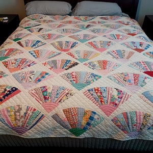 Grandmother's Fan quilt with scalloped top from 1940's hand sewn and quilted, 71" x 71" size.