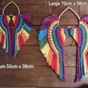 Large and medium Angel chakra wings. Infuses all the colours of the chakras. Using 5mm single  twisted cotton cord on an mdf heart base.
Please be advised that the wings may need time to relax once the item is taken out of the box.
