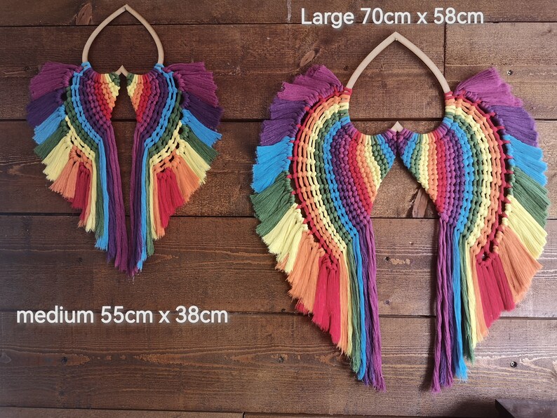 Large and medium Angel chakra wings. Infuses all the colours of the chakras. Using 5mm single  twisted cotton cord on an mdf heart base.
Please be advised that the wings may need time to relax once the item is taken out of the box.