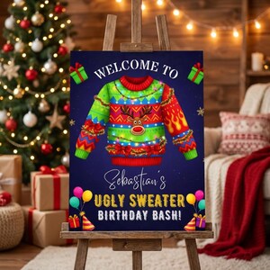 May include: A dark blue rectangular sign on a wooden easel featuring a colourful illustrated sweater with a reindeer face, red bows, and string lights. The text reads: WELCOME TO Sebastian's UGLY SWEATER BIRTHDAY BASH! with balloons and gift boxes.