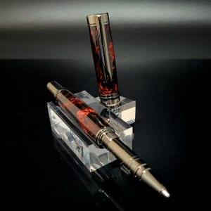 Custom Rollerball Pen with Gunmetal Fittings Featuring this Beautiful Black and Red Carolina Swirl Polyester Blank