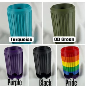 May include: A collection of reusable travel cups in various colors: turquoise, OD green, purple, black, and a rainbow Pride design. Each cup features vertical ribbed detailing and a rounded base. The color names are displayed below each cup.