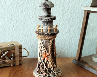 Lighthouse wood 22 cm driftwood with fishing net, boat and starfish