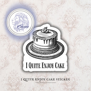 May include: A sticker featuring a detailed black and white illustration of a layered cake with chocolate dripping down the sides. The text "I Quite Enjoy Cake" is below the cake. A lion's head logo is in the upper left.