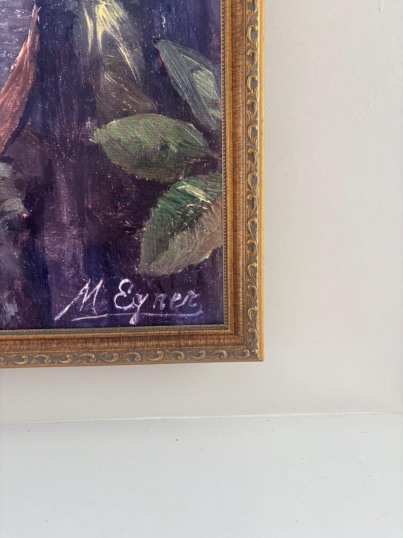 May include: Oil painting in a gold ornate frame. The artwork features a dark, moody color palette with visible brushstrokes. Green leaves and other foliage are visible. The artist's signature, "M. Eyner", is in the lower left corner.