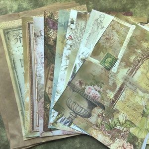 May include: A collection of vintage-style scrapbook paper sheets with floral, botanical, and antique design elements. The papers feature faded colors, including beige, green, and brown, with decorative frames, stamps, and handwritten text. A stack of brown paper bags is visible on the left.
