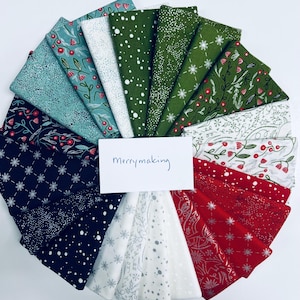 May include: A collection of 18 fabric squares in various holiday-themed patterns, including snowflakes, holly, and berries. The fabrics are in shades of green, red, white, and black. The text "Merrymaking" is written on a white card in the center of the image.