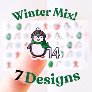 May include: A sticker featuring a cartoon penguin wearing a green scarf and a hat with red, green, and black stripes. The number 14 is next to the penguin. The words "Winter Mix!" and "7 Designs" are also visible.