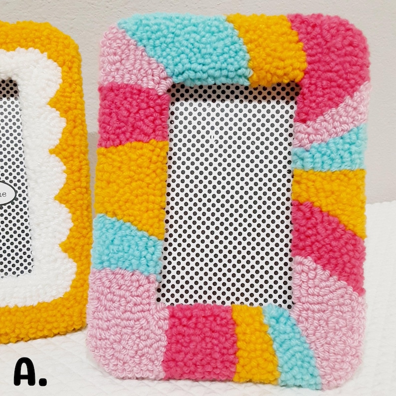 Colorful handmade punch needle photo frames in bright pink, yellow, blue, and white yarn. These 4x6 hand-tufted picture frames are perfect for fun, playful decor. Cozy textured frame designs ideal for desk styling, room decor, or unique gifts.