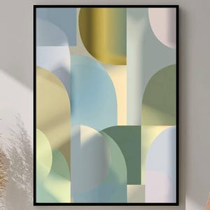 May include: Abstract art print in a black frame. The artwork features a geometric design with overlapping shapes in shades of blue, green, yellow, and gray. The composition includes semi-circles, rectangles, and other forms, creating a modern and colorful aesthetic.