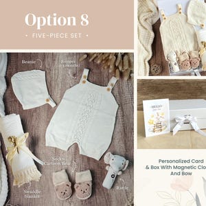 May include: A five-piece baby gift set in a white box with a magnetic closure and a bow. The set includes a white knitted romper, beanie, socks, a swaddle blanket, and a rattle. The box also includes a personalized card with the text "Hello Little One".