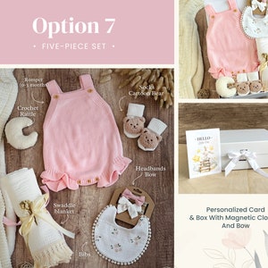May include: A five-piece baby gift set in a pink and white color scheme. The set includes a pink knitted romper, a white swaddle blanket, a crochet rattle, a pair of socks with a cartoon bear design, and a bib with a floral pattern. The set is packaged in a white gift box with a magnetic closure and a bow. The box also includes a personalized card with the text "HELLO Little One".