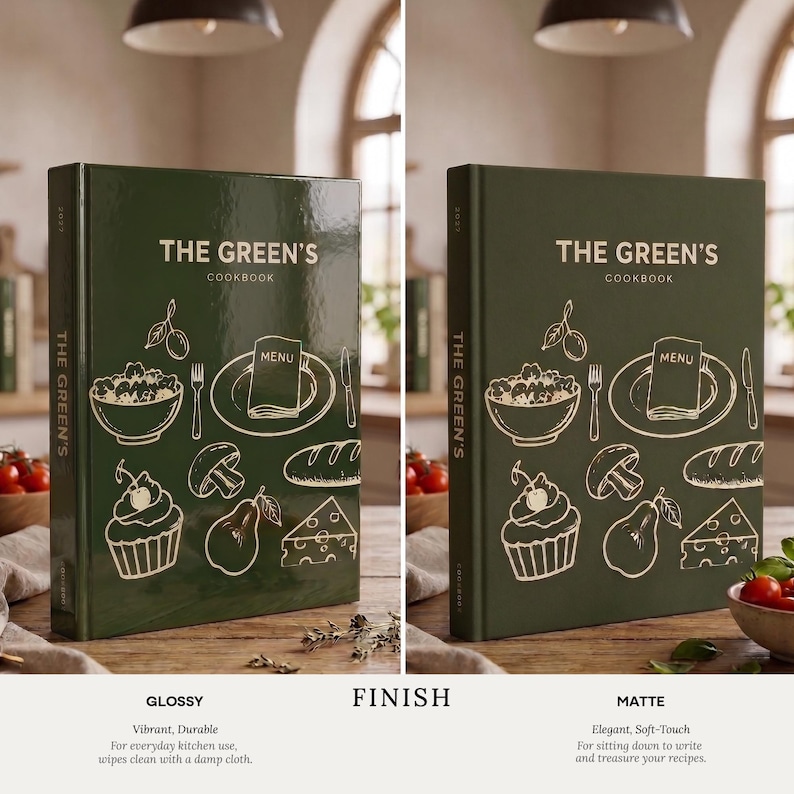 May include: A dark green hardback cookbook titled THE GREEN'S COOKBOOK with gold line art illustrations of food items including a bowl, a menu on a plate, a cupcake, a mushroom, a pear, a slice of cheese, and a loaf of bread on the front cover.