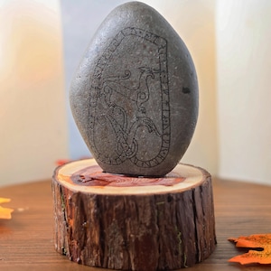 Viking age runestone cut in stone and mounted in cedar cross-section, U 991