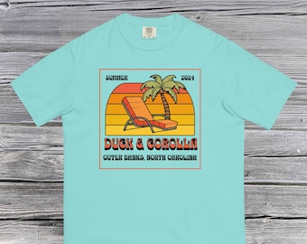 Oibx Duck and Corolla Beach Unisex Comfort Farben Sommer-T-Shirt, Outer Banks North Carolina, Corova Beach EC Sommer Grafik T