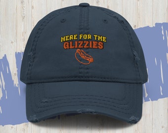 May include: A navy blue distressed baseball cap with the text "HERE FOR THE GLIZZIES" in yellow and orange lettering with a cartoon hot dog graphic.