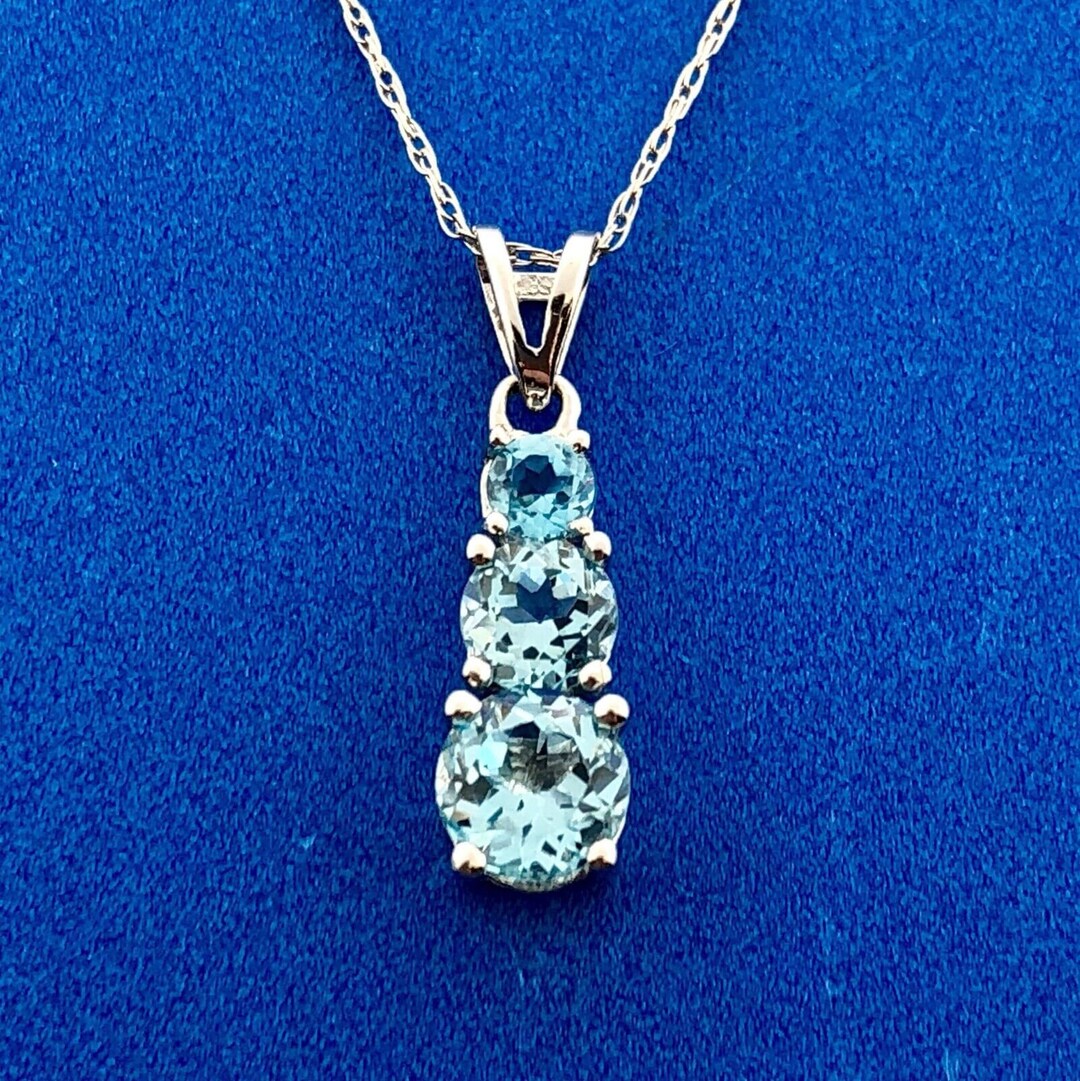 9ct White Gold 0.77ct Round Blue Topaz and Diamond Pendant