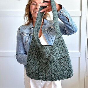 Granny square bag pattern with a woman holding the finished bag, made of granny squares.