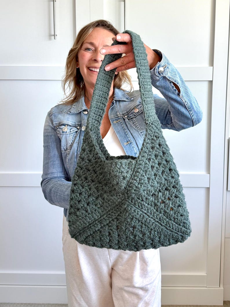 Granny square bag pattern with a woman holding the finished bag, made of granny squares.