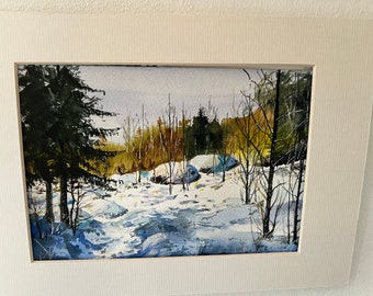 May include: A watercolor painting of a snowy winter scene with a forest in the background. The trees are bare and the ground is covered in white snow. There are a few small, blue-colored objects in the foreground, which may be rocks or boulders.