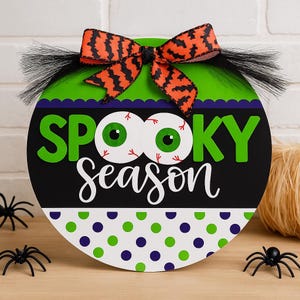 Halloween Door Hanger: Spooky Eyeball Sign with Bat Bow