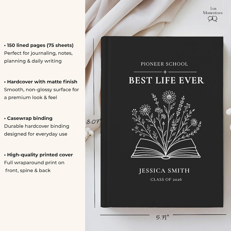 May include: Black hardcover journal with the text "PIONEER SCHOOL BEST LIFE EVER" and the name "JESSICA SMITH CLASS OF 2026". The journal is 5.71 inches wide and 8.07 inches tall. Features include 150 lined pages, a matte finish, and casewrap binding.