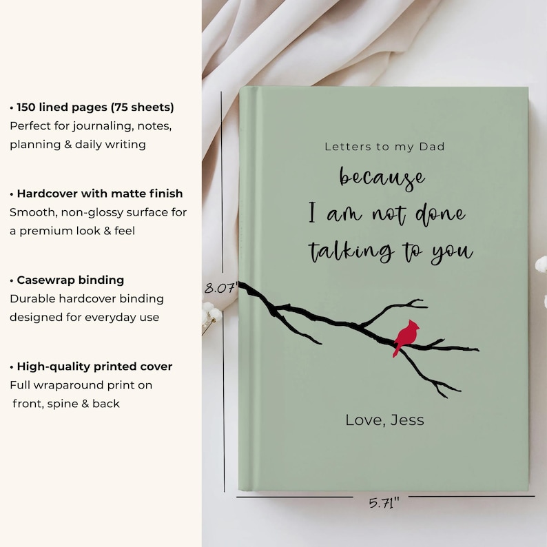 Op de afbeelding: Een hardcover journal met een matte afwerking. De cover is lichtgroen met de tekst "Letters to my Dad because I am not done talking to you." Een zwarte tak met een rode vogel staat op de cover. Het journal meet 14,5 cm x 20,5 cm.