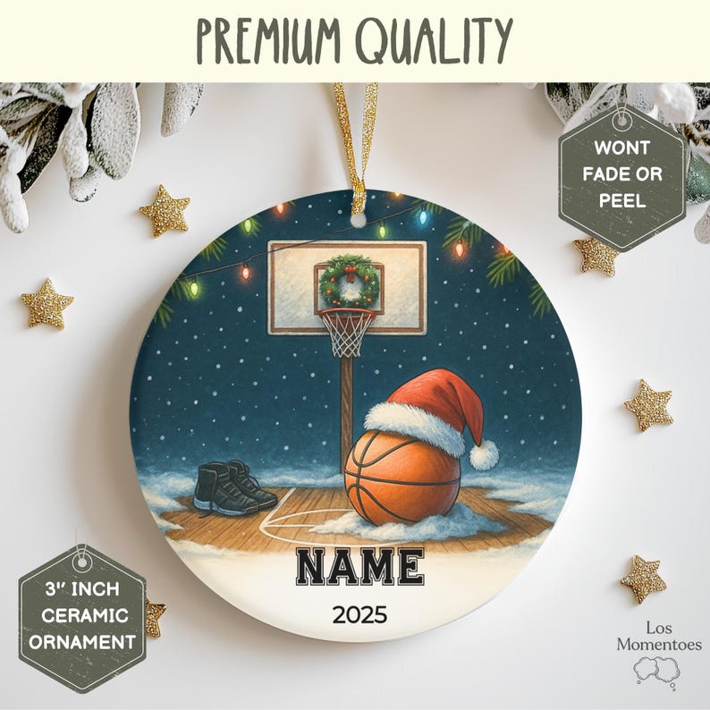 May include: A 3-inch ceramic Christmas ornament featuring a basketball court scene with a basketball wearing a Santa hat. The ornament has the text "NAME" and "2025". The background is a snowy night scene with a basketball hoop and a pair of sneakers.