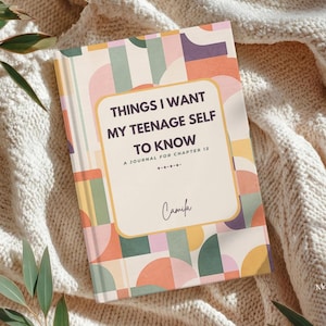 May include: A journal titled "THINGS I WANT MY TEENAGE SELF TO KNOW" with a colorful geometric pattern cover. The journal has a cream-colored background with text in a rounded rectangle. The author's name, Camila, is at the bottom.