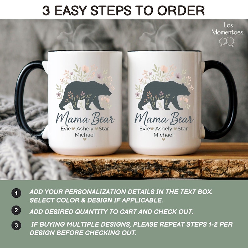 May include: Two white ceramic Mama Bear mugs with black handles and rims. Each mug features a dark gray bear silhouette surrounded by floral accents and the text "Mama Bear" with personalized names below. The image also includes ordering instructions.
