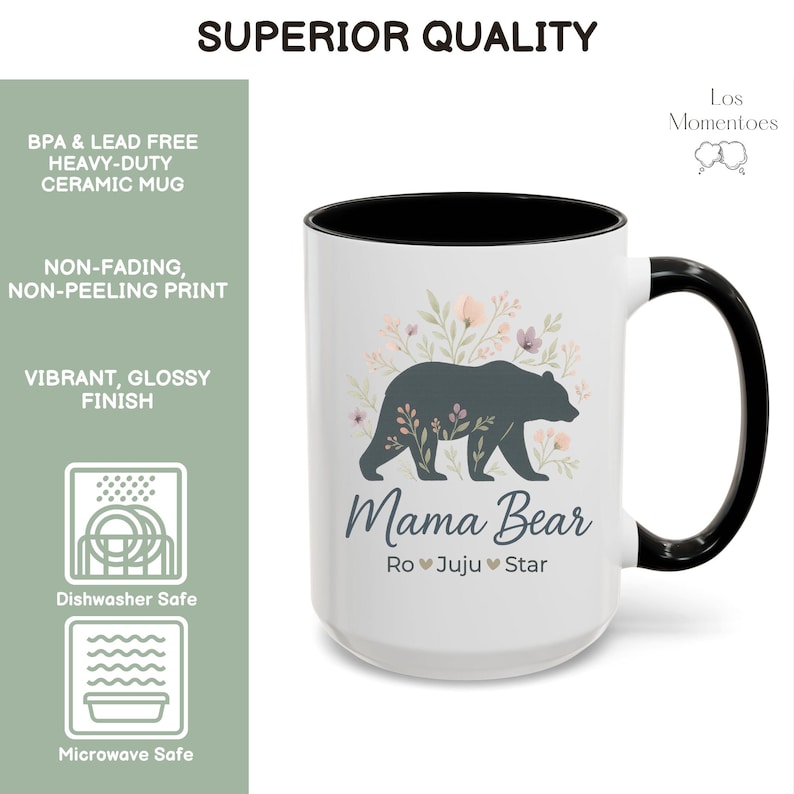May include: White ceramic mug with a black interior and handle. The mug features a dark gray bear silhouette with floral accents and the words "Mama Bear" below. The mug is dishwasher and microwave safe.